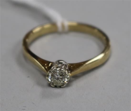 A modern 9ct gold and collet set solitaire diamond ring, size V.